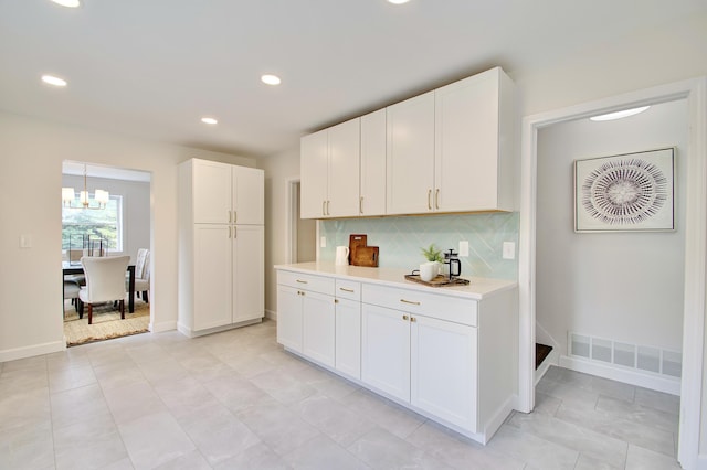 797 Highland Ave, Fort Wright, KY 41011 - kitchen featuring light countertops, recessed lighting, tasteful backsplash, white cabinets, and a chandelier