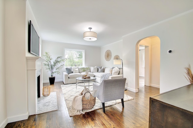 797 Highland Ave, Fort Wright, KY 41011 - living area with arched walkways, wood finished floors, and a fireplace with flush hearth