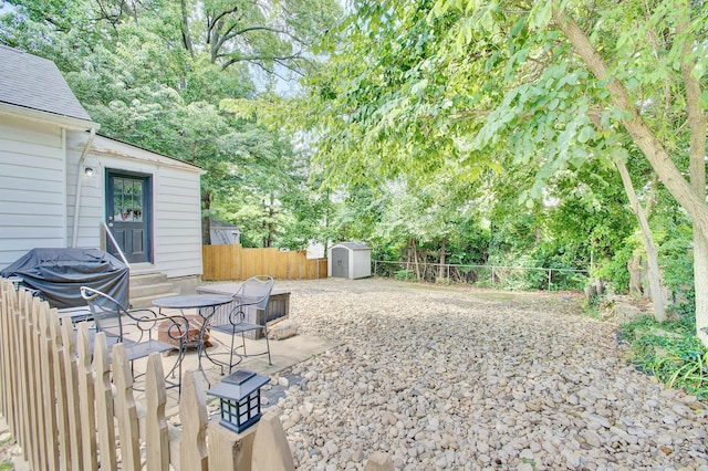 29 Crowell Ave, Fort Thomas, KY 41075 - fenced backyard featuring a storage shed, entry steps, and view of scattered trees
