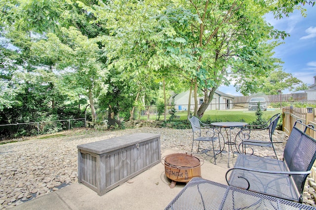 29 Crowell Ave, Fort Thomas, KY 41075 - fenced backyard with a fire pit, outdoor dining space, and a patio