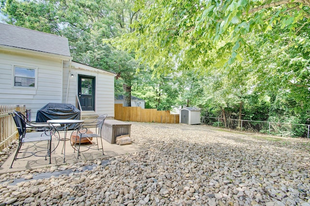 29 Crowell Ave, Fort Thomas, KY 41075 - fenced backyard with a shed, grilling area, and a patio area