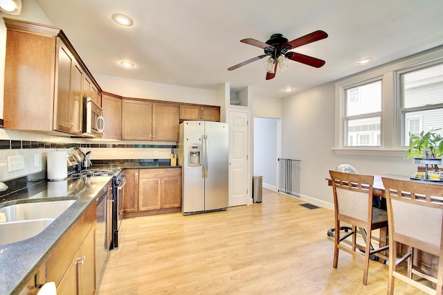 29 Crowell Ave, Fort Thomas, KY 41075 - kitchen featuring appliances with stainless steel finishes, ceiling fan, light wood-type flooring, brown cabinetry, and recessed lighting