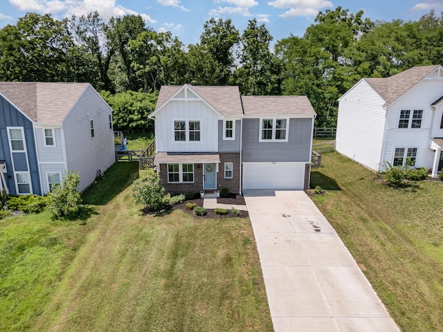 928 Darlington Creek Dr, Alexandria, KY 41001 - traditional home with board and batten siding, driveway, brick siding, a garage, and a front yard