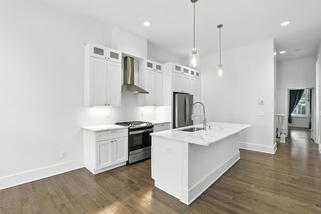 310 W Robbins St, Covington, KY 41011 - kitchen featuring stainless steel appliances, wall chimney range hood, an island with sink, dark wood finished floors, and recessed lighting