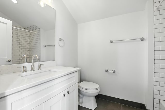 310 W Robbins St, Covington, KY 41011 - full bath featuring lofted ceiling, tile patterned flooring, vanity, and a shower