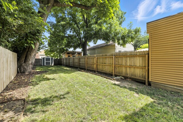 310 W Robbins St, Covington, KY 41011 - fenced backyard featuring a storage unit