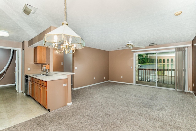 37 Rio Grande Cir Unit 5, Florence, KY 41042 - kitchen featuring a chandelier, ceiling fan, a textured ceiling, light countertops, and pendant lighting