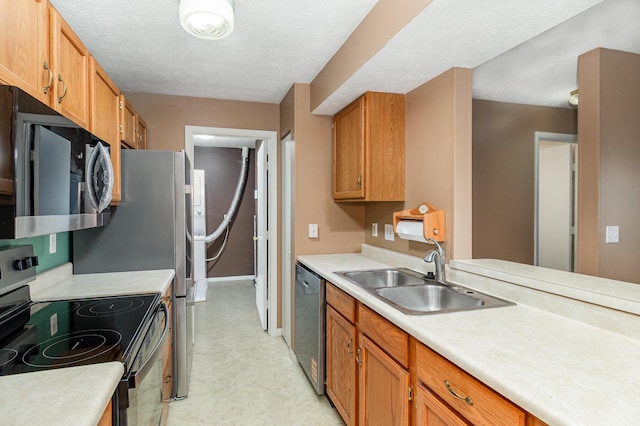 37 Rio Grande Cir Unit 5, Florence, KY 41042 - kitchen with stainless steel appliances, light flooring, light countertops, brown cabinets, and a textured ceiling