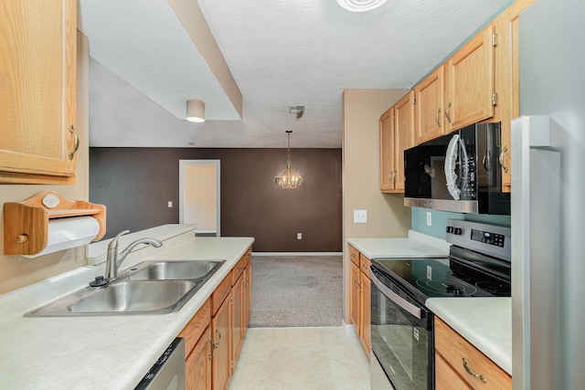 37 Rio Grande Cir Unit 5, Florence, KY 41042 - kitchen featuring stainless steel appliances, light countertops, pendant lighting, light carpet, and a textured ceiling