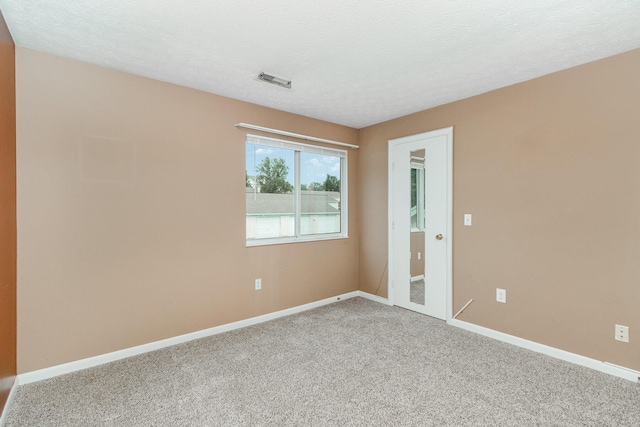 37 Rio Grande Cir Unit 5, Florence, KY 41042 - carpeted spare room featuring baseboards and a textured ceiling