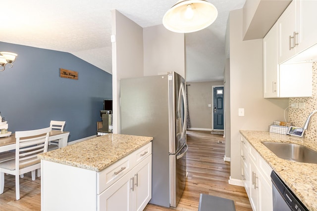 30 Valeside Dr, Covington, KY 41017 - kitchen with stainless steel appliances, lofted ceiling, light wood finished floors, white cabinets, and light stone countertops