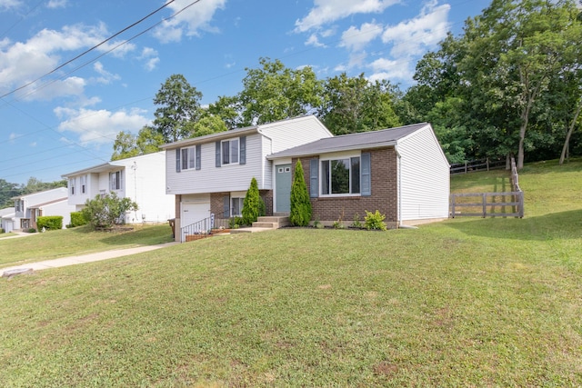 30 Valeside Dr, Covington, KY 41017 - view of front of home with brick siding, an attached garage, and driveway