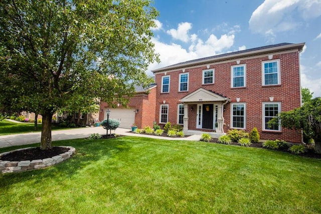 800 Buck Ct, Erlanger, KY 41018 - view of front of home with driveway, brick siding, a front yard, and an attached garage