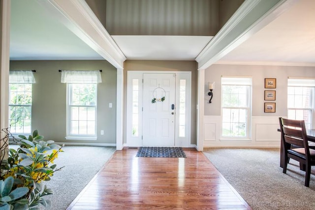 800 Buck Ct, Erlanger, KY 41018 - foyer entrance featuring healthy amount of natural light, wood finished floors, a wainscoted wall, and crown molding