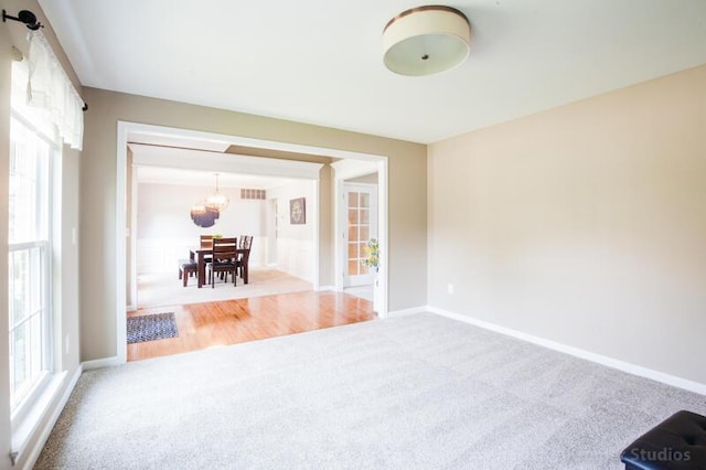 800 Buck Ct, Erlanger, KY 41018 - carpeted spare room with a chandelier and baseboards