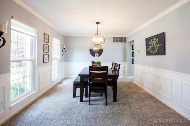 800 Buck Ct, Erlanger, KY 41018 - carpeted dining space featuring a chandelier, plenty of natural light, ornamental molding, and wainscoting