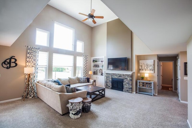 800 Buck Ct, Erlanger, KY 41018 - living room with high vaulted ceiling, carpet flooring, a ceiling fan, and a stone fireplace