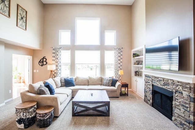 800 Buck Ct, Erlanger, KY 41018 - living area featuring a towering ceiling, light colored carpet, plenty of natural light, and a fireplace