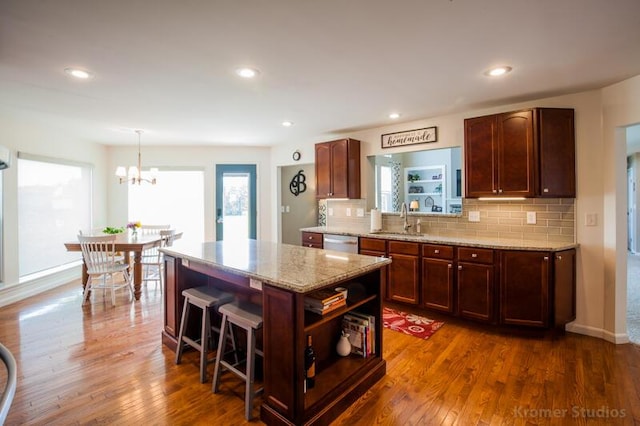 800 Buck Ct, Erlanger, KY 41018 - kitchen with open shelves, dishwasher, backsplash, dark wood-type flooring, and a chandelier