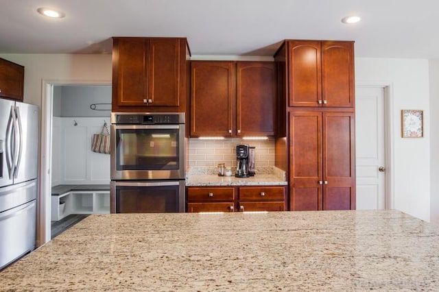800 Buck Ct, Erlanger, KY 41018 - kitchen with stainless steel appliances, light stone counters, decorative backsplash, and recessed lighting