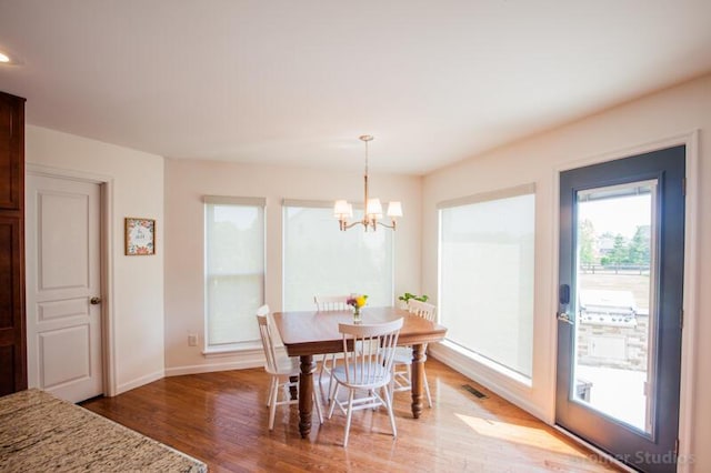 800 Buck Ct, Erlanger, KY 41018 - dining area with light wood-style flooring and a chandelier