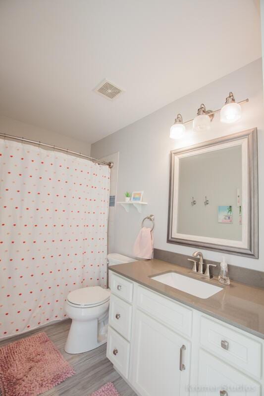 800 Buck Ct, Erlanger, KY 41018 - bathroom with vanity, wood finished floors, and a shower with curtain