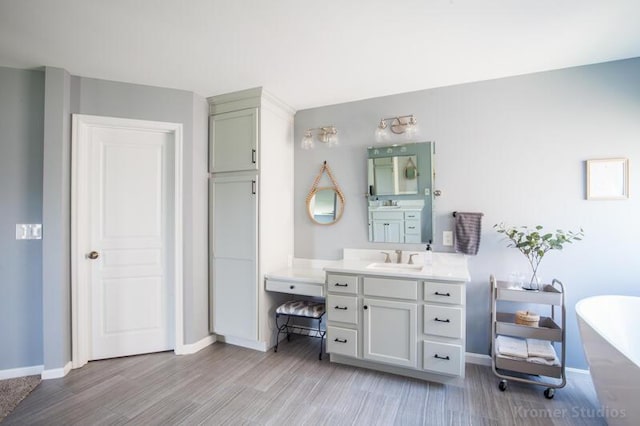800 Buck Ct, Erlanger, KY 41018 - bathroom with a soaking tub, vanity, and wood finished floors
