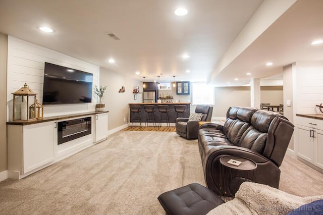 800 Buck Ct, Erlanger, KY 41018 - living room featuring bar with sink, light colored carpet, and recessed lighting