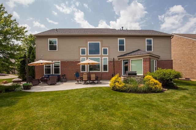 800 Buck Ct, Erlanger, KY 41018 - rear view of property featuring a patio, a lawn, and brick siding