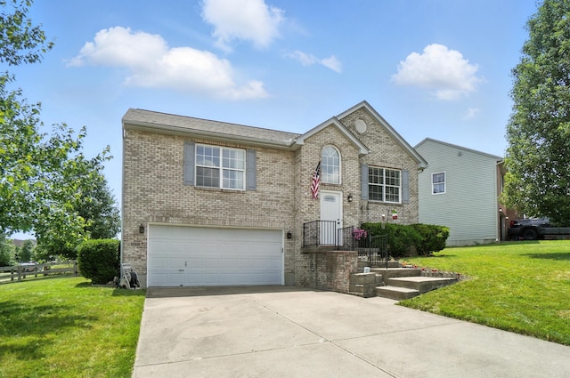 1625 Hogan Ln, Florence, KY 41042 - view of front facade featuring an attached garage, brick siding, a front yard, and driveway
