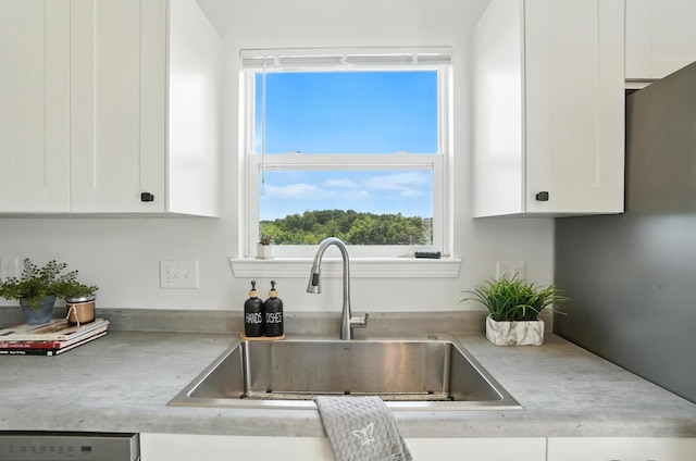 1625 Hogan Ln, Florence, KY 41042 - kitchen with white cabinetry, light countertops, and dishwasher