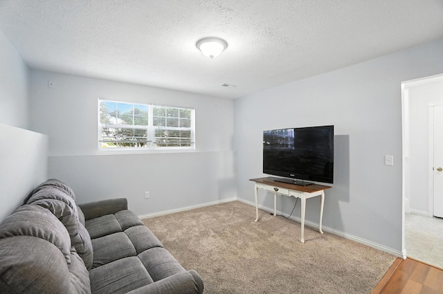 1625 Hogan Ln, Florence, KY 41042 - living area featuring a textured ceiling and wood finished floors