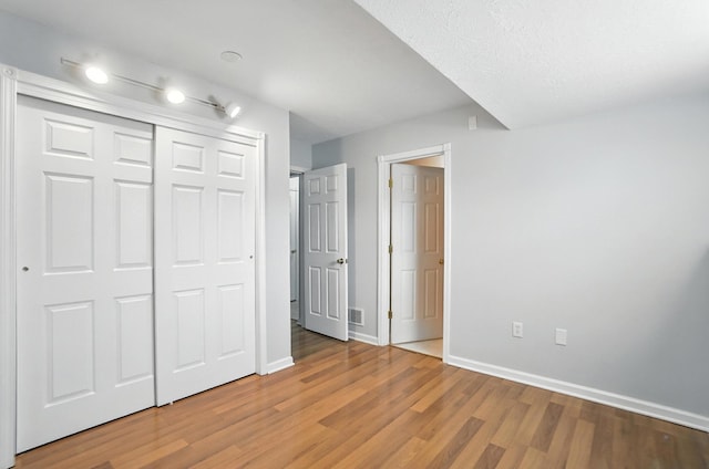 1625 Hogan Ln, Florence, KY 41042 - unfurnished bedroom featuring light wood-style floors and a closet