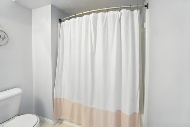 1625 Hogan Ln, Florence, KY 41042 - bathroom featuring toilet and a shower with shower curtain