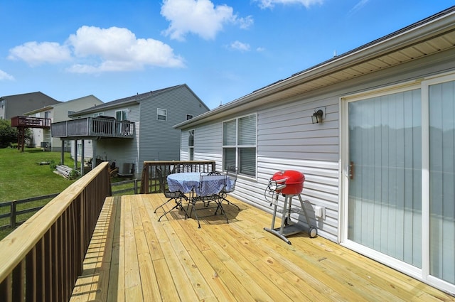 1625 Hogan Ln, Florence, KY 41042 - wooden deck featuring outdoor dining space and a lawn
