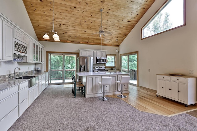 445 Elk Lake Resort Rd Unit 390, Owenton, KY 40359 - kitchen with appliances with stainless steel finishes, high vaulted ceiling, light colored carpet, white cabinetry, and wooden ceiling