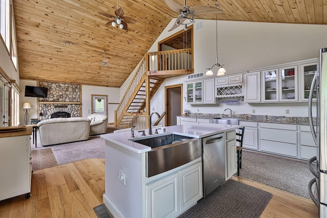 445 Elk Lake Resort Rd Unit 390, Owenton, KY 40359 - kitchen featuring appliances with stainless steel finishes, high vaulted ceiling, wood ceiling, a fireplace, and white cabinetry