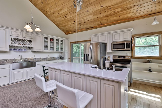 445 Elk Lake Resort Rd Unit 390, Owenton, KY 40359 - kitchen with appliances with stainless steel finishes, healthy amount of natural light, wood ceiling, decorative light fixtures, and white cabinets