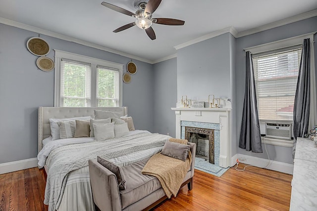 3141 Beech Ave, Covington, KY 41015 - bedroom featuring cooling unit, hardwood / wood-style flooring, a fireplace, crown molding, and a ceiling fan