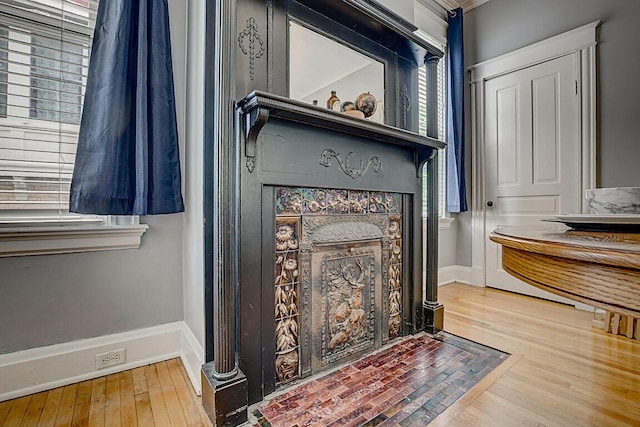 3141 Beech Ave, Covington, KY 41015 - detailed view of wood finished floors and a fireplace with flush hearth
