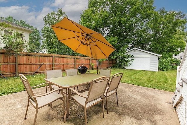 3141 Beech Ave, Covington, KY 41015 - fenced backyard featuring outdoor dining area, a patio area, a detached garage, and an outbuilding