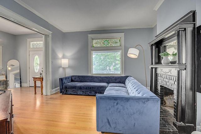 3141 Beech Ave, Covington, KY 41015 - living room with wood finished floors, healthy amount of natural light, a fireplace, and ornamental molding