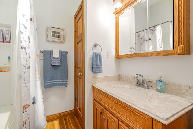 3950 Elliston Mount Zion Rd, Dry Ridge, KY 41035 - full bath with vanity, wood finished floors, and a shower with shower curtain