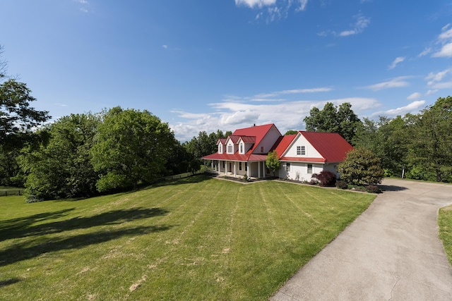 405 Alexander Rd, Crittenden, KY 41030 - cape cod house featuring a front lawn and a metal roof