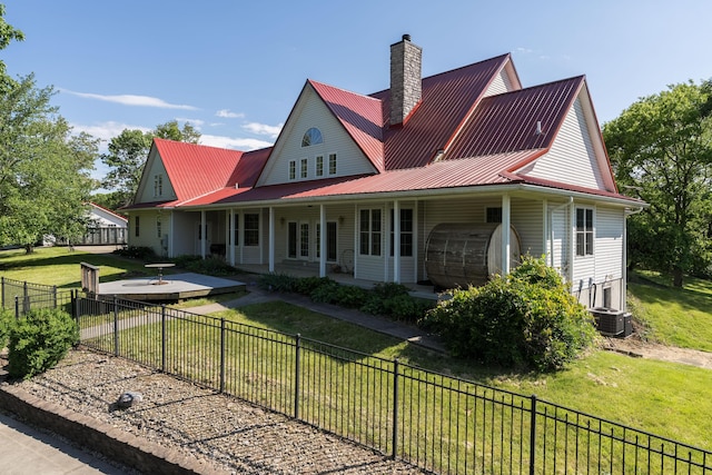 405 Alexander Rd, Crittenden, KY 41030 - view of front of property with a chimney, a metal roof, and a fenced backyard