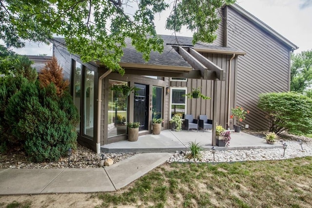 108 Regency Ct, Highland Heights, KY 41076 - back of house featuring board and batten siding, a shingled roof, and a patio area