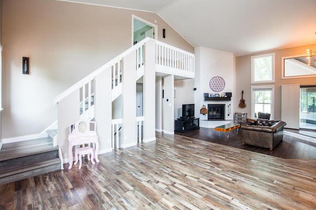 108 Regency Ct, Highland Heights, KY 41076 - living area featuring high vaulted ceiling, stairway, wood finished floors, and a glass covered fireplace
