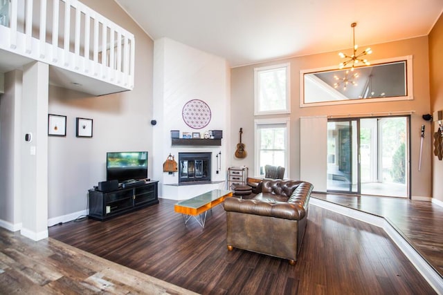 108 Regency Ct, Highland Heights, KY 41076 - living area with a high ceiling, a chandelier, a fireplace, and wood finished floors