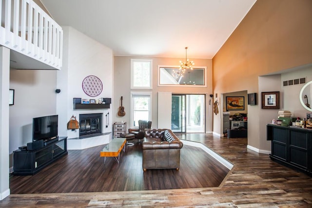 108 Regency Ct, Highland Heights, KY 41076 - living room with a high ceiling, a chandelier, a tile fireplace, and wood finished floors