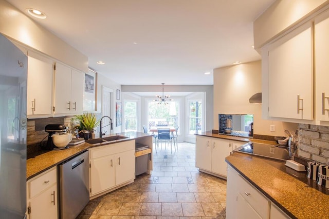 108 Regency Ct, Highland Heights, KY 41076 - kitchen with stainless steel dishwasher, a peninsula, decorative backsplash, white cabinets, and recessed lighting